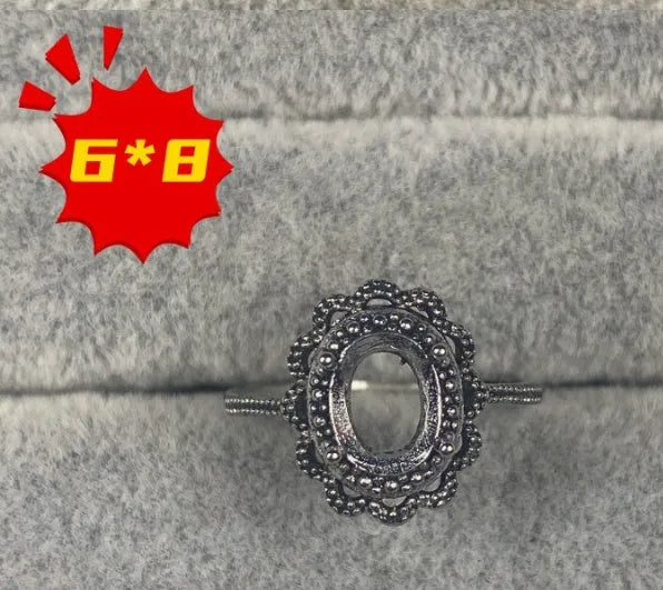 Oval denier ring ornament with open mouth design, 6x8mm stone and five-pointed star detail