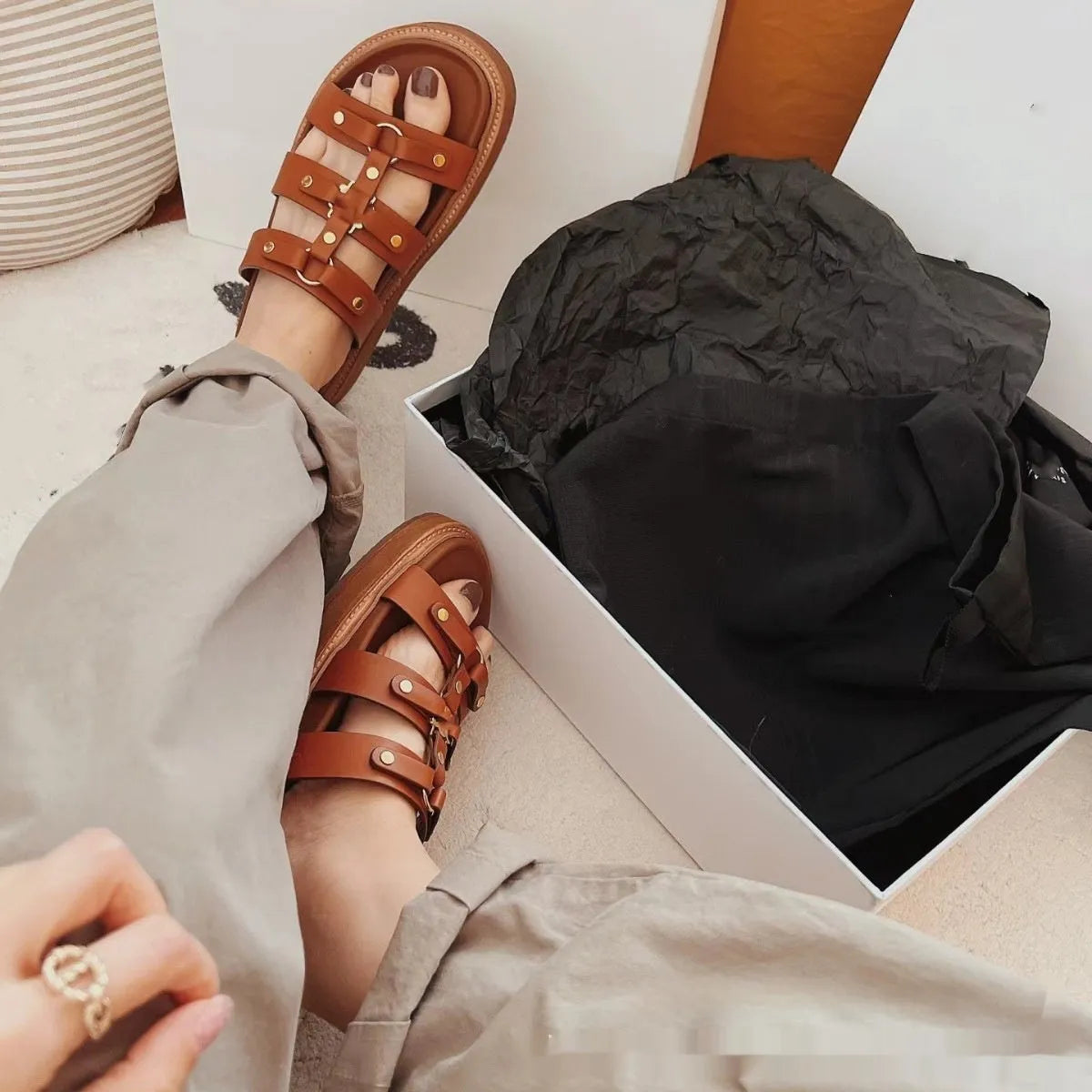 Women's Roman style sandal slippers in sheepskin with patent leather finish, showing colour options