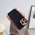Leather texture TPU phone case for iPhone in solid black colour on a white background.