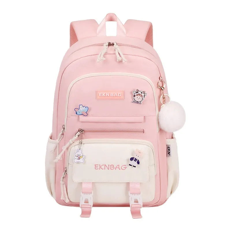 Girls waterproof Oxford cloth school backpack with curved shoulder straps and spine protection in solid colour options.
