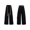 Men's dark blue loose straight-leg jeans with tassel decoration and front zipper placket.
