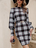 Black women's tight dress with voluminous lantern sleeves and decorative leather stitching details.