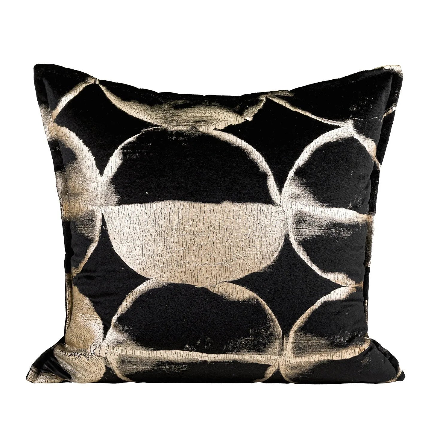 Black and gold abstract pattern decorative flannel pillow with removable cover on a grey sofa.