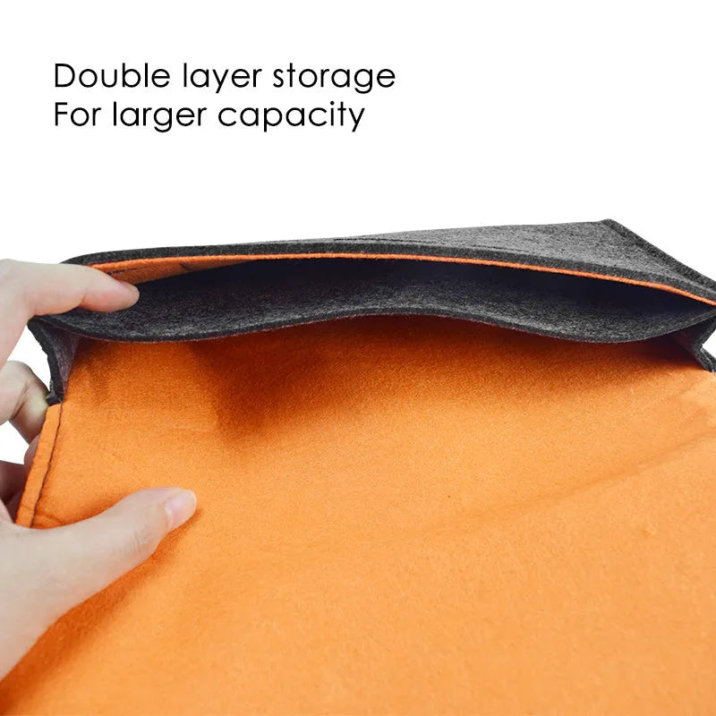 Black Nintendo Switch felt pouch case open, showing console slot and 5-game card holder.