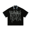 Men's loose asymmetric short-sleeved cotton top with graffiti print in blue.