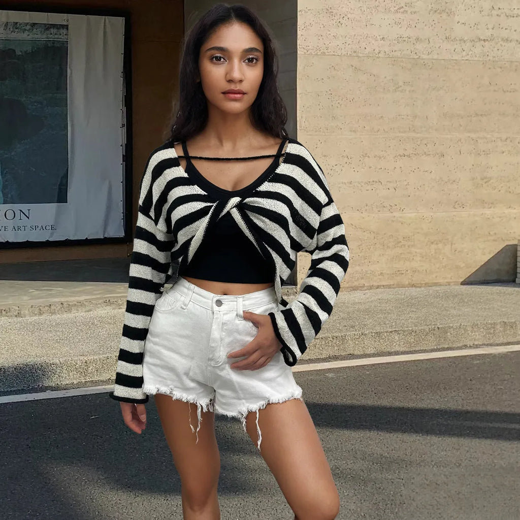 Women's black and white striped long-sleeved sweater with an exposed navel design, worn as a front and back wearable top.