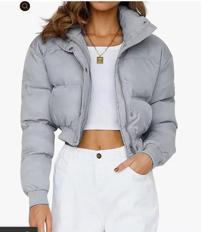 Loose fit women's polyester jacket in beige, black, or blue colour with long sleeves.