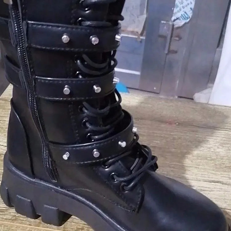 Women's black mid-calf knight boots with a metal buckle strap and side zipper on a round toe.