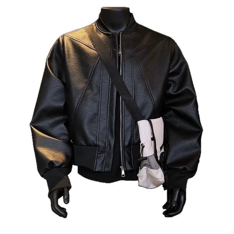 Man wearing a long black PU leather jacket with a tight, tailored fit.