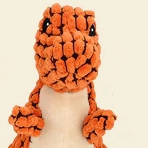 Set of four grey, green, and orange dog toys with sound features for chewing and training