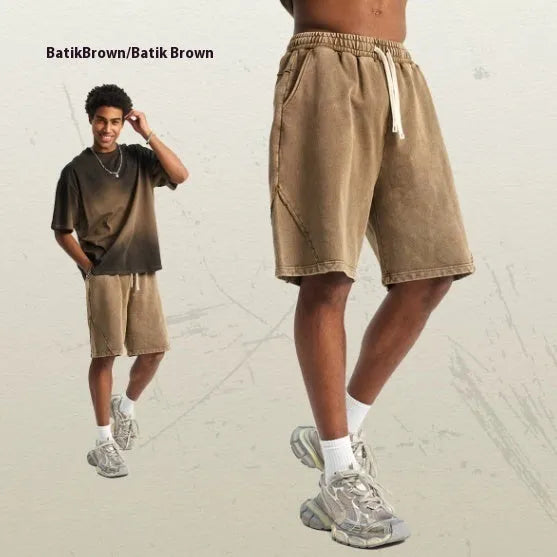 Men's loose fit batik washed patch craft retro shorts in pure cotton terry fabric showing street fashion style