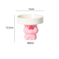 Raised ceramic cat bowl with cute animal design in pink, yellow, or white on a white background