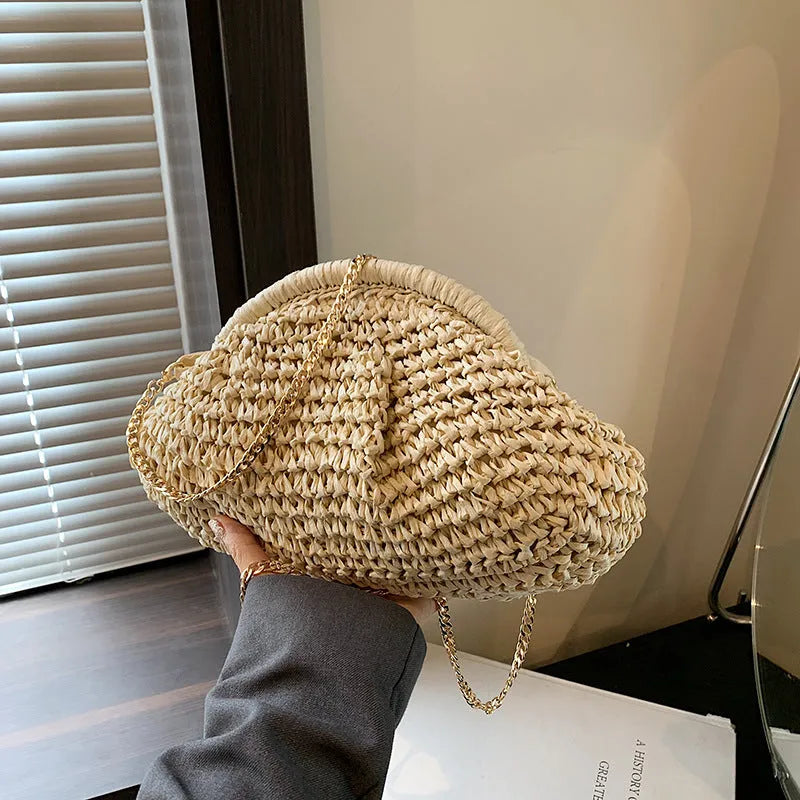 Women's woven paper straw beach bag with shoulder chain in khaki colour showing interior zip pocket
