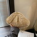 Women's woven paper straw beach bag with shoulder chain in khaki colour showing interior zip pocket