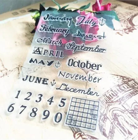 Close-up of a transparent silicone vintage calendar and digital table icon stamp on a white background.