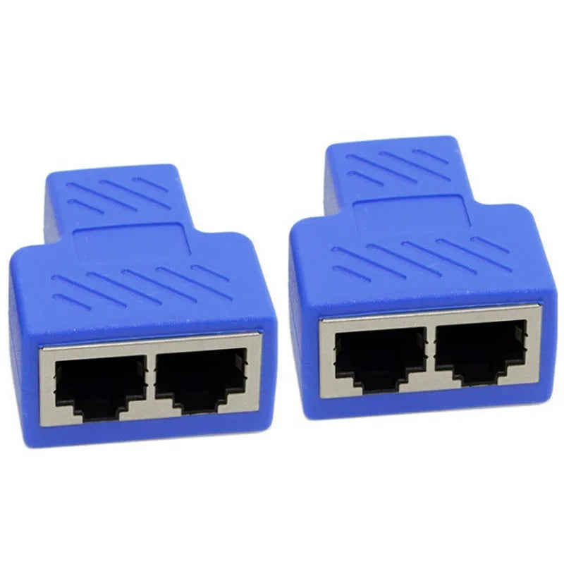 Two white RJ45 three-way network tee splitters on a table.