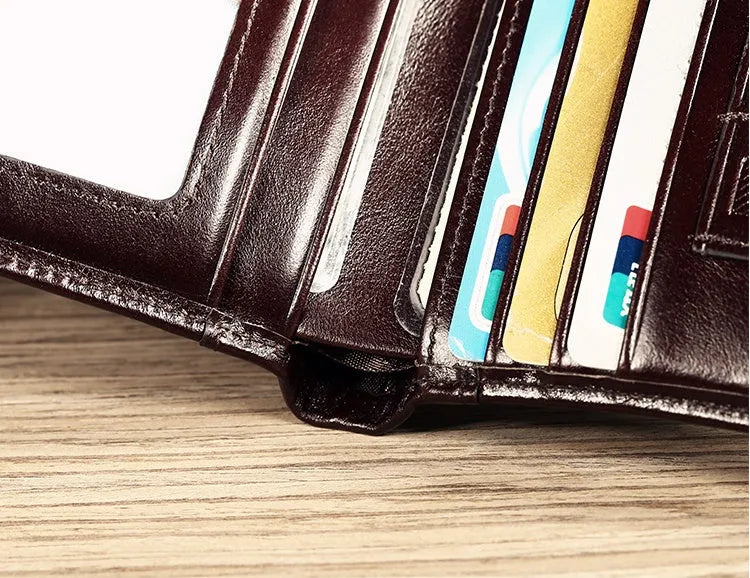 Men's leather wallet open showing photo holder, card slots, banknote folder, and hidden zippered compartment.
