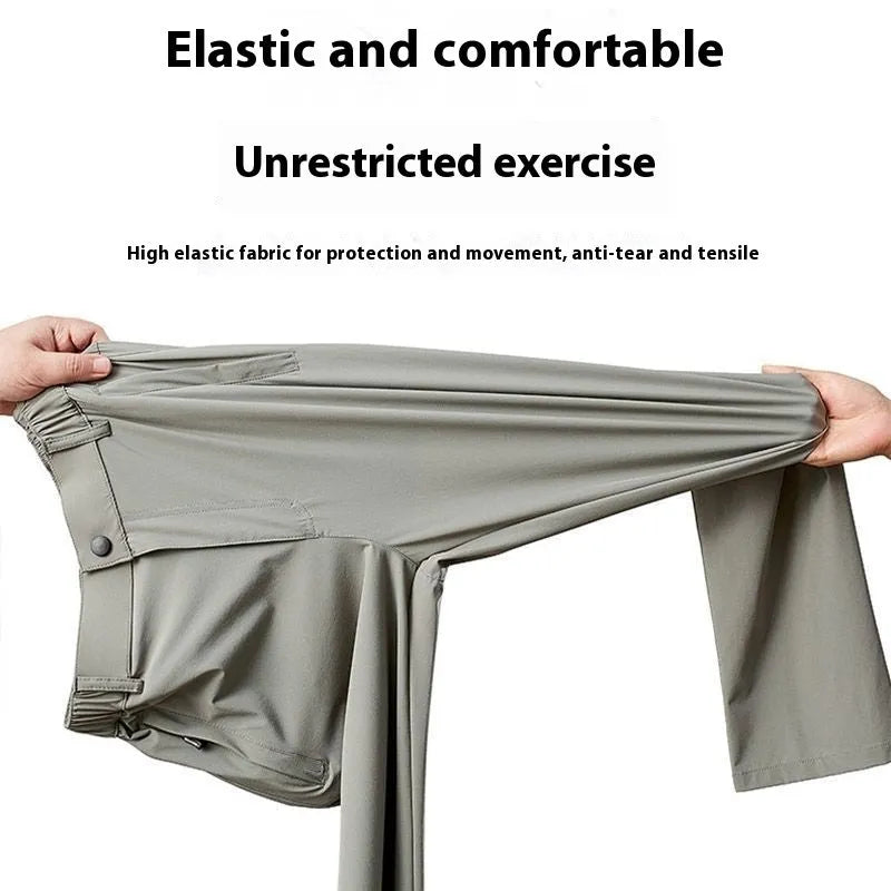 Man wearing black Ice Silk loose-fit straight-leg trousers with an elasticated waist for casual leisure wear.