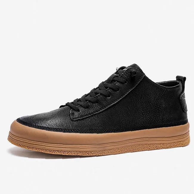 Men's black leather casual shoes with round toe, flat heel, and white rubber sole on a plain background.