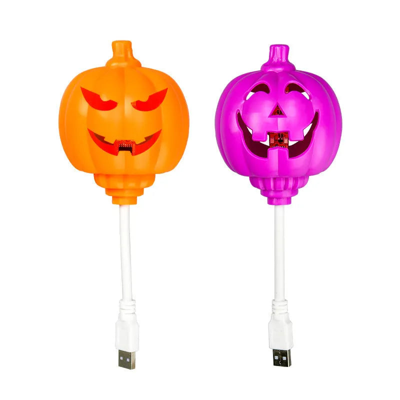 Plastic pumpkin lamp with USB charging cable in purple or yellow light colour