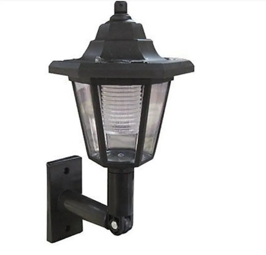 Black hexagonal solar wall lamp with solar panel and LED light for outdoor installation