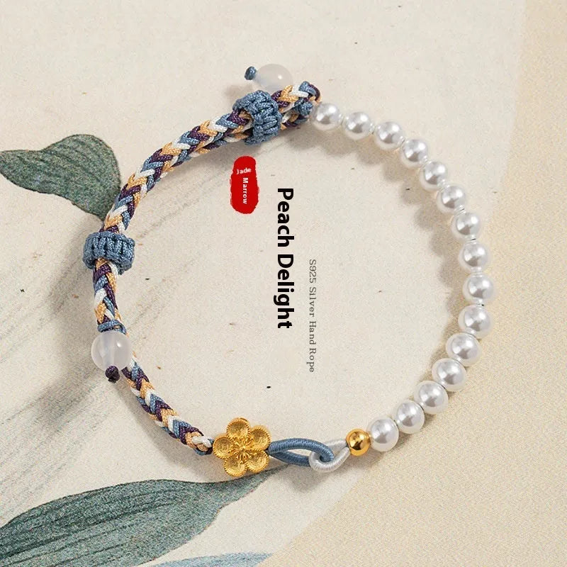 Peach coloured carrying strap bracelet with Chinese flower weaving pattern featuring sterling silver chalcedony and pearl decorative elements