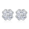 Close-up of women's heart-shaped 925 silver earrings with four-leaf clover zircon inlay, white gold colour finish.