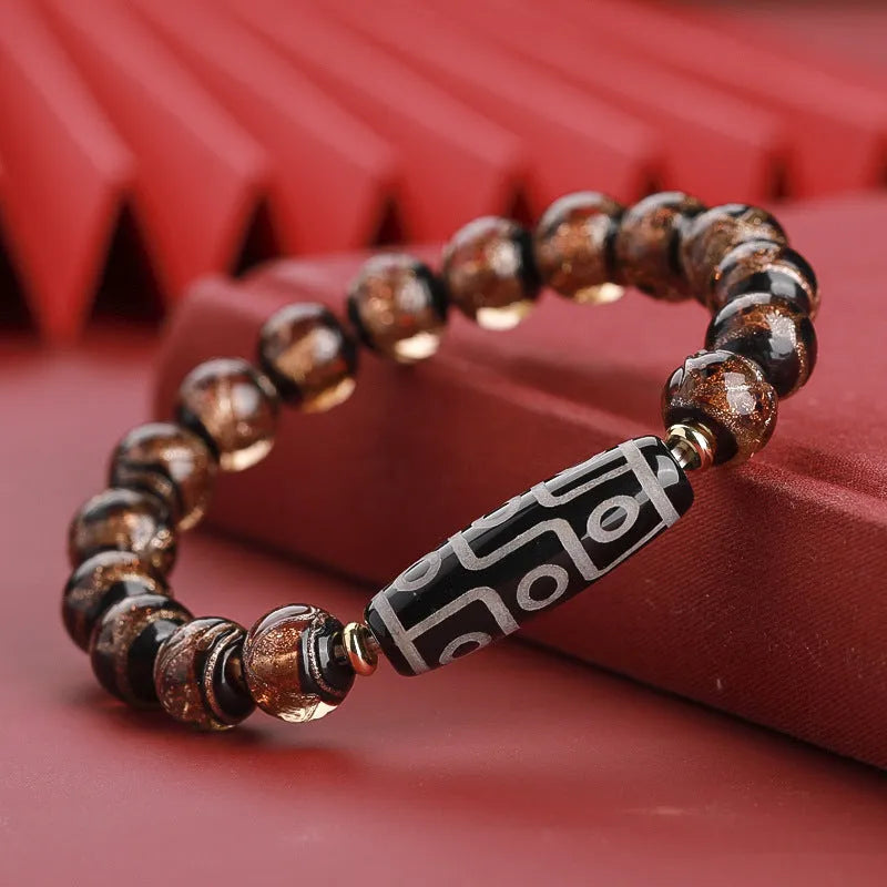 Chinese style lucky bracelet with colourful coloured glaze beads and auspicious patterns.