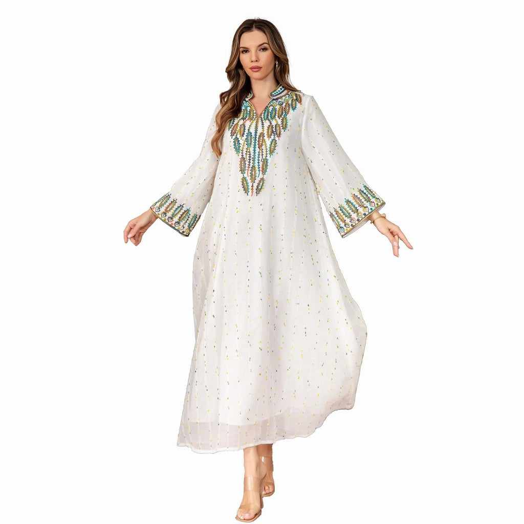 White full-length Arabic robe for women with long sleeves, made from polyester fabric.