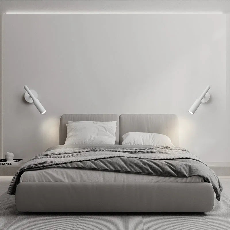 Modern cylindrical wrought iron wall lamp in black or white with three colour light settings.