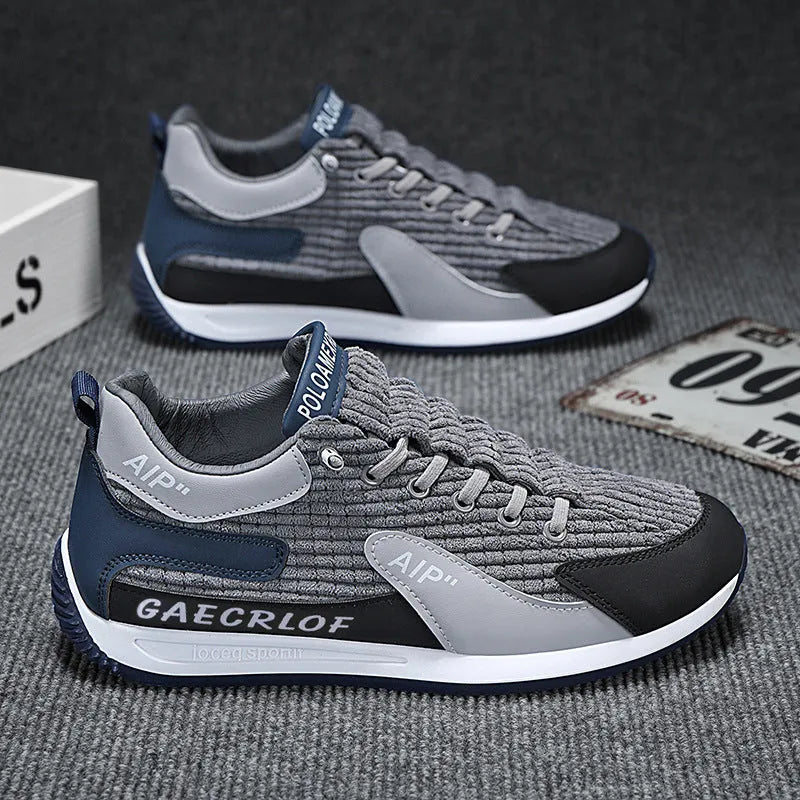 Men's low-top green and grey mesh running shoes with lace-up front.