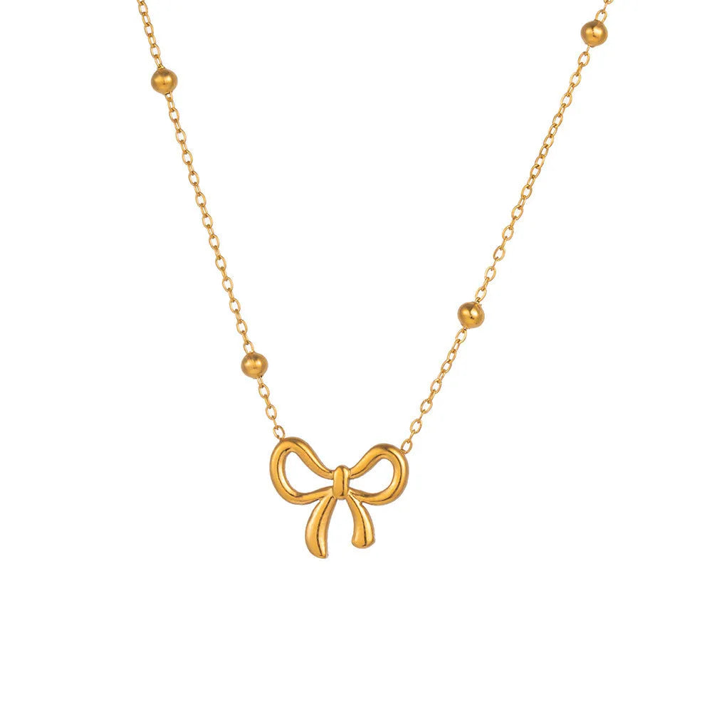Gold bow necklace on cross chain with adjustable 41-50cm length