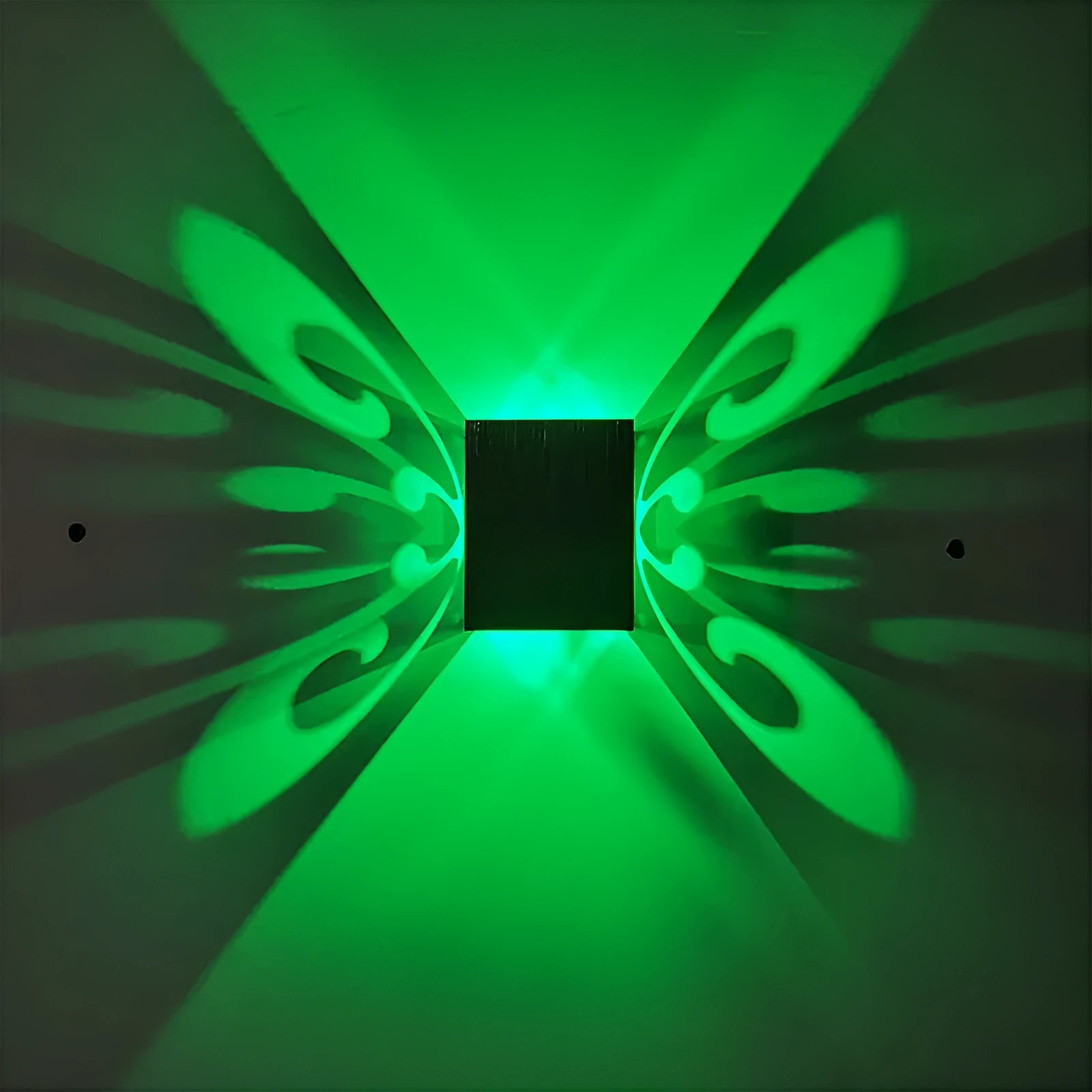 Modern aluminium butterfly-shaped LED wall lamp with remote control on a plain background.