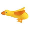 Yellow plush teddy dog toy with attached duck doll and food leak compartments for pet training