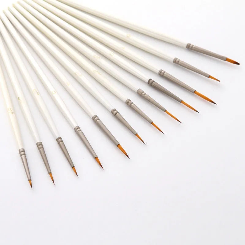 Pearl white fluorescent art marker set with 12 nylon wool brushes in a solid wood holder.