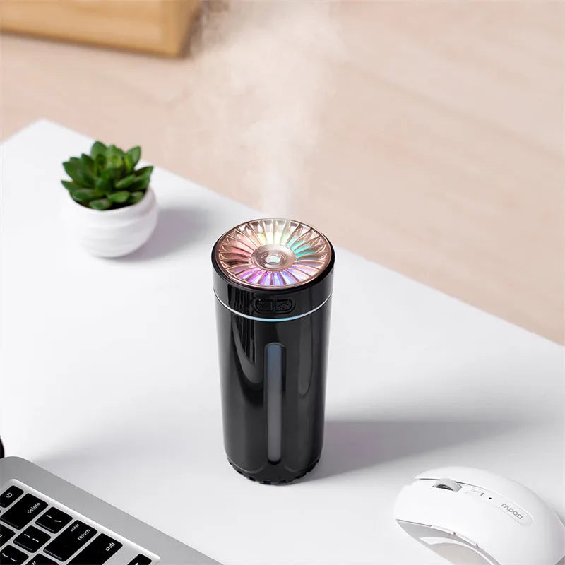 Black wireless air humidifier with colourful LED lights on a car cup holder