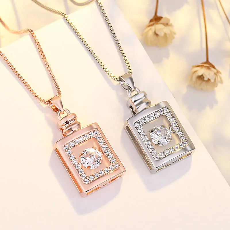 Copper heart-shaped pendant necklace with crown and bow details in rose gold or silver colour
