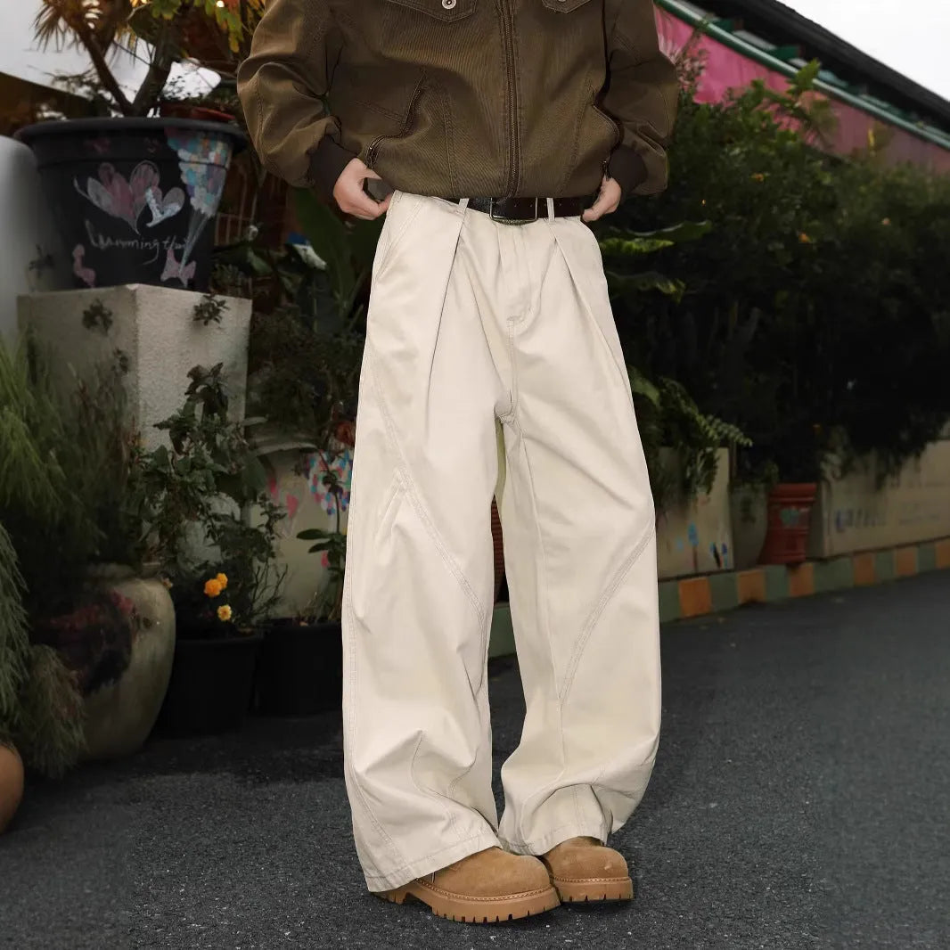 Men's apricot straight-leg loose fit trousers with elastic waist on a hanger.