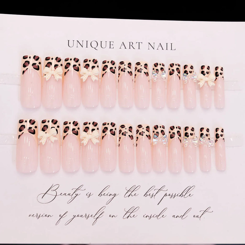 Leopard print butterfly design plastic nail art decorations set on a white background