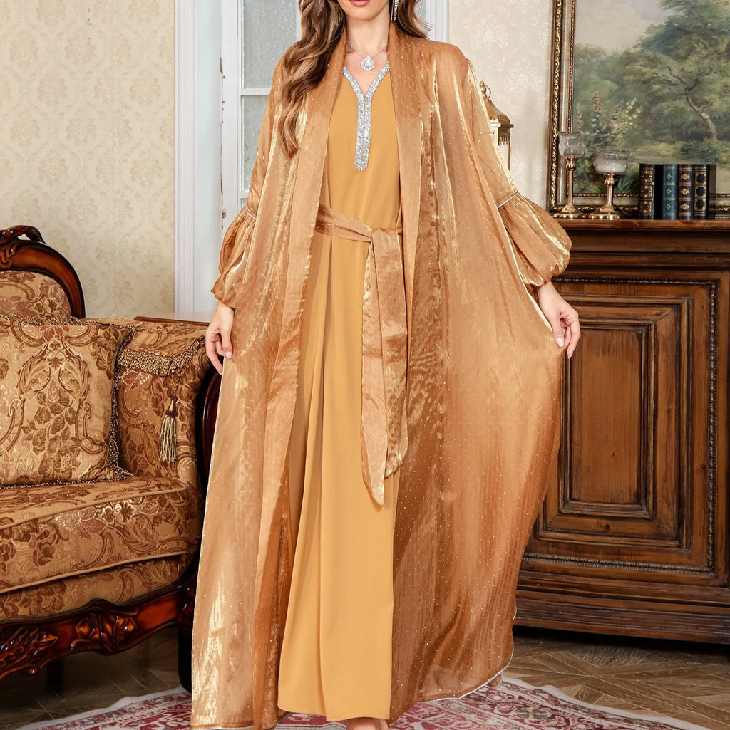 Arabic style two-piece evening dress with rhinestone embellishment and long sleeves in blue colour