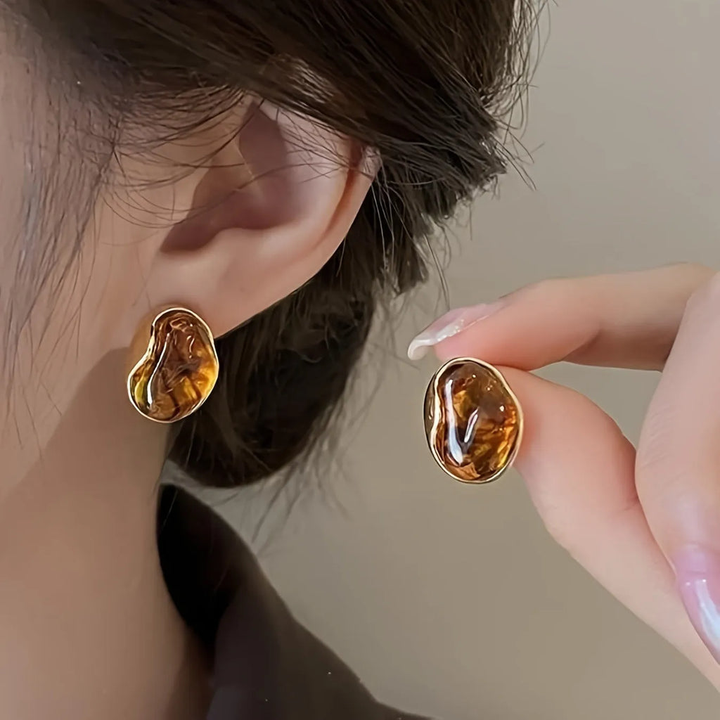 Handmade geometric tassel earrings in three electroplated styles: round piece, irregular, and water drop designs