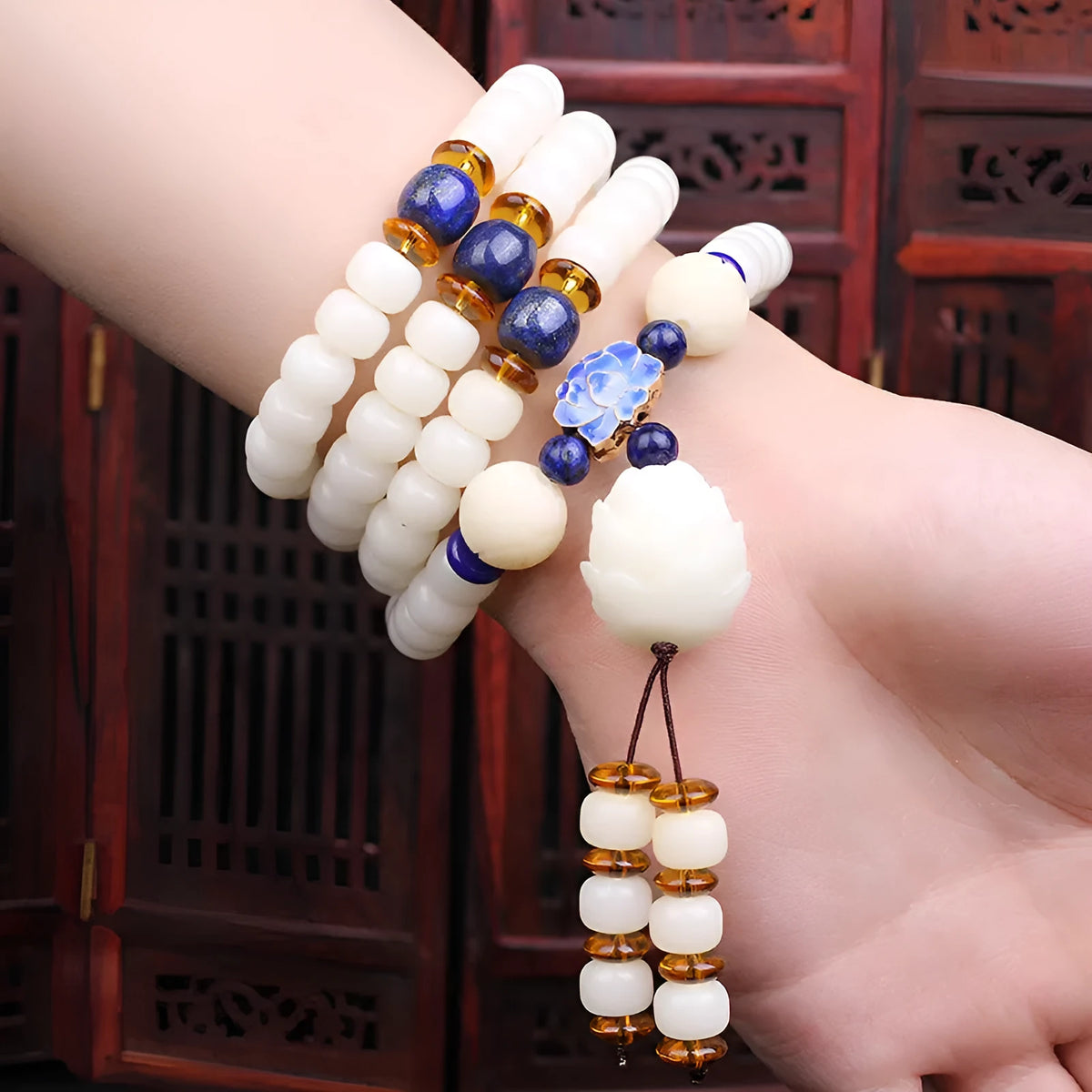 White jade bodhi bead long bracelet showing 6x8mm beads in a cloisonne style design.