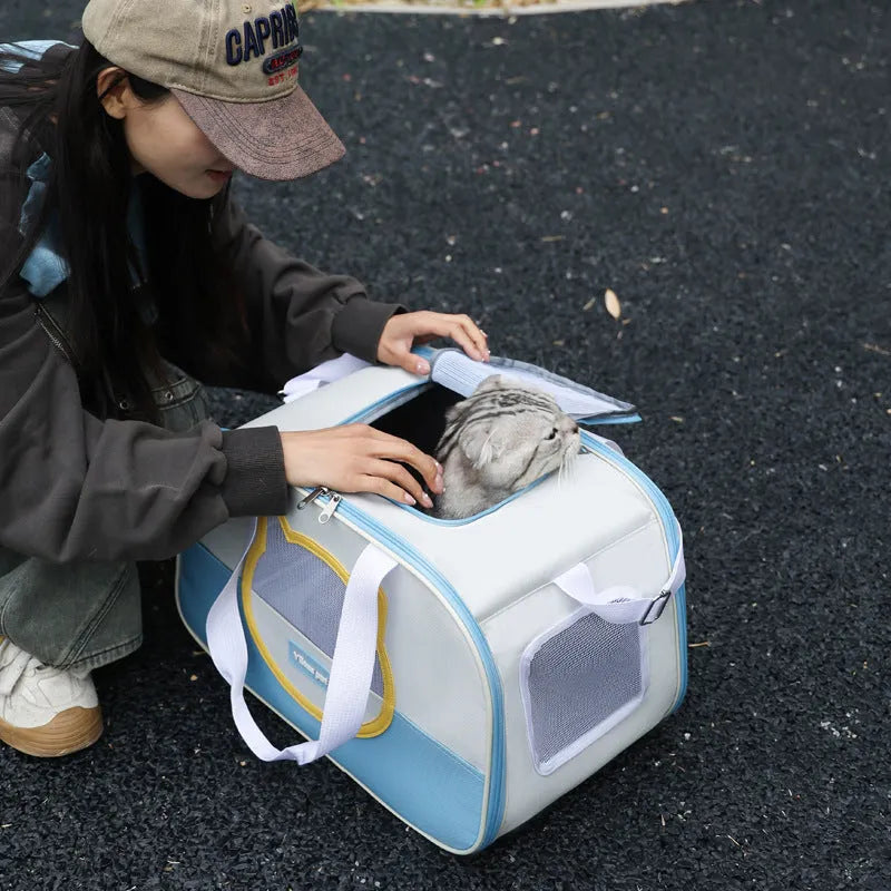 Blue foldable cat backpack made from Oxford cloth, shown with ventilation and shoulder straps.