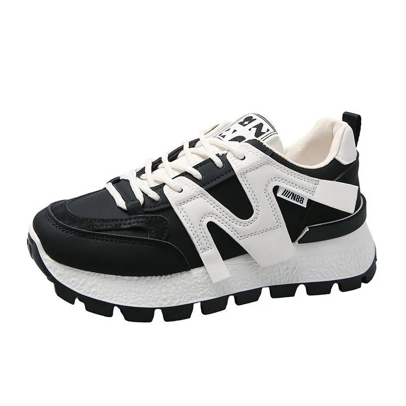 Low-top white running sneakers with round toe and front lace-up design on rubber sole