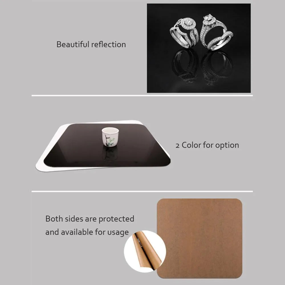 Square black and white acrylic reflection board for tabletop photography.