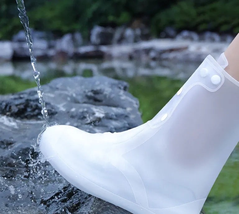 White PVC high top reusable water resistant shoe covers shown on a shoe.
