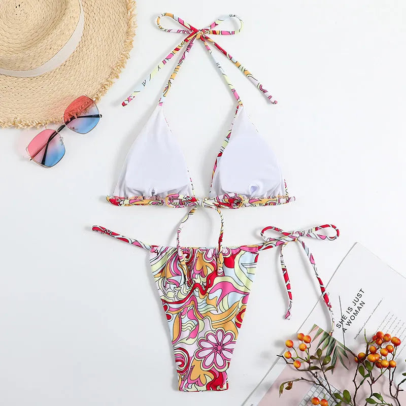 Women's triangle printed bikini set with halter neck top and separate bottom in multicolor pattern