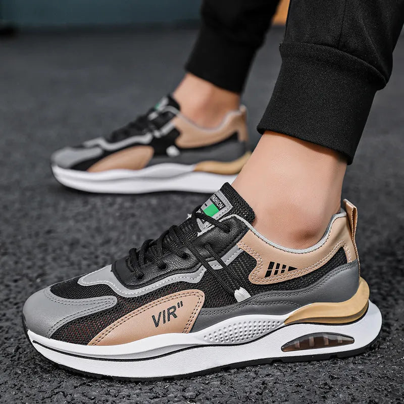 Men's grey mesh running shoes with mid-top height and rounded toe design on white background