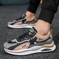 Men's grey mesh running shoes with mid-top height and rounded toe design on white background