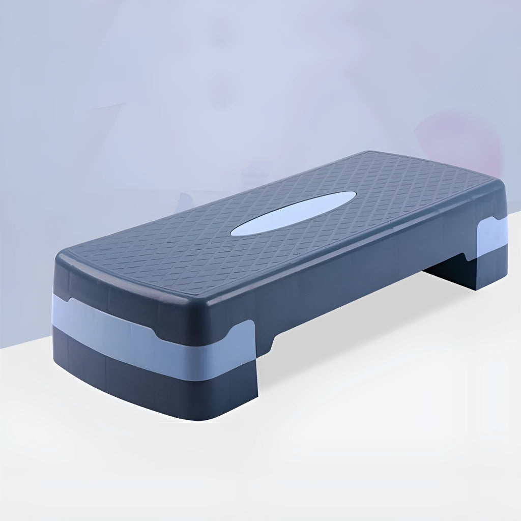 A grey ABS plastic step aerobics platform for fitness workouts, showing its size and textured surface.